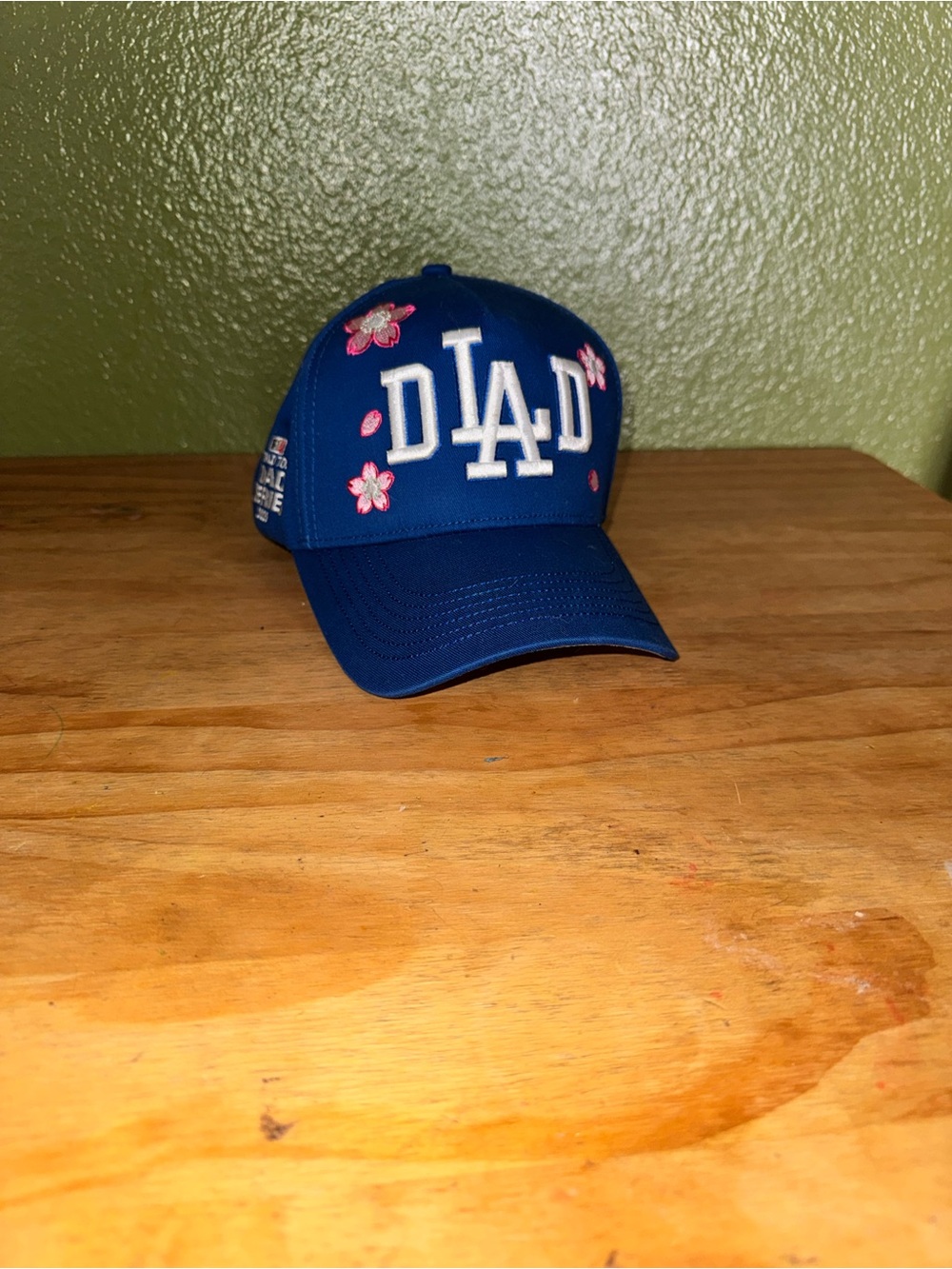 Blue 'DAD' Embroidered Baseball Cap with Pink Floral Accents